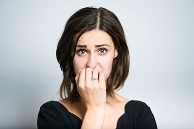 Woman biting nails