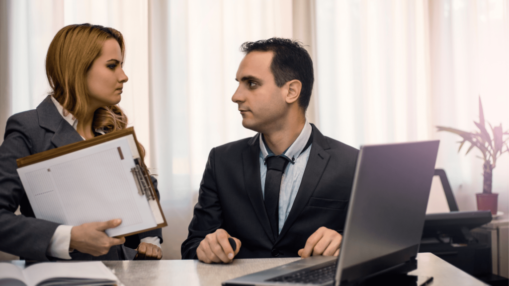 Two workers having a very serious conversation