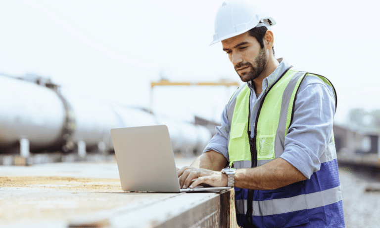 industrial engineer outside near oil and gas pipe