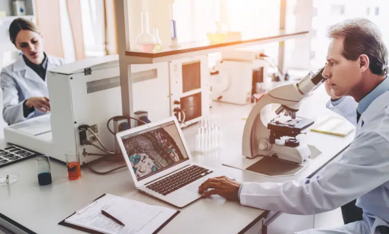 scientists working on lab equipment