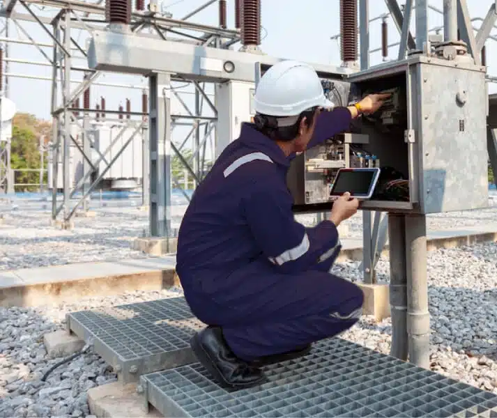 Engineer crouching while working at station