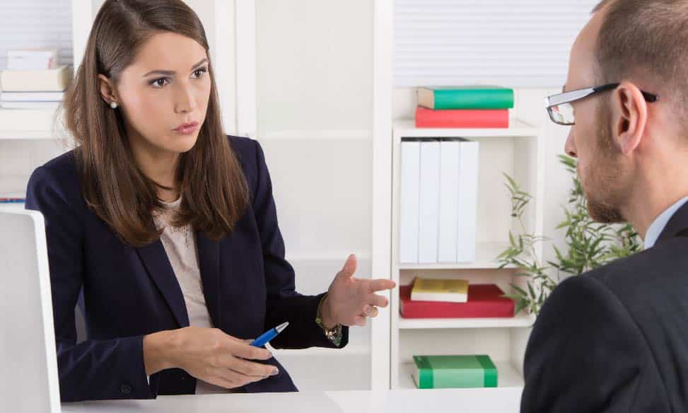 Recruiter having a discussion with a jobseeker at desk
