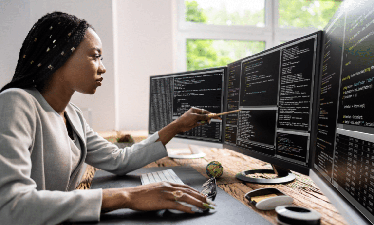 web developer coder using a computer at desk