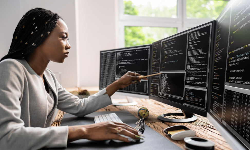 web developer coder using a computer at desk