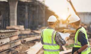 a team of civil engineers and construction engineers inspecting a construction site